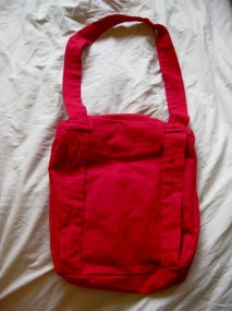 red messenger bag back