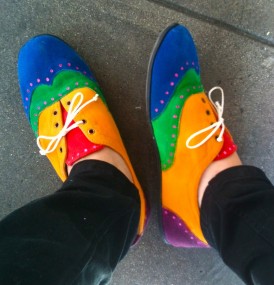 rainbows on the soles of her shoes